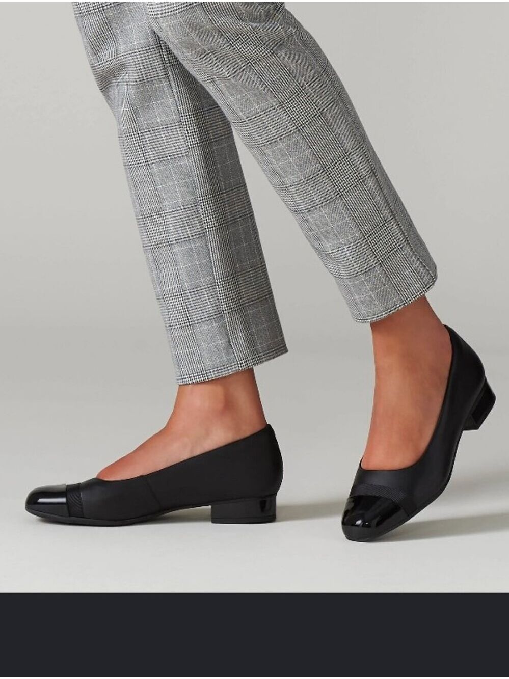 Clarks Juliet Monte black leather pumps, featuring a glossy patent cap toe